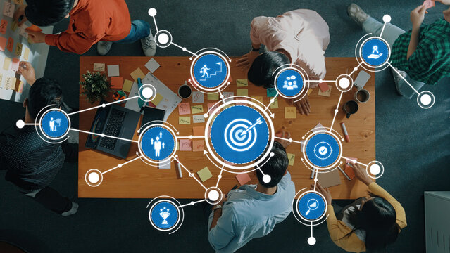 A vibrant collaborative workspace showcasing digital target icons and interactive elements, perfect for illustrating business strategy and effective team brainstorming sessions. Amity