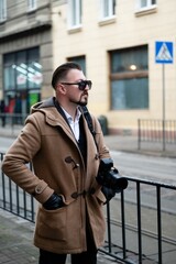 Stylishly capturing moments on a bustling street in the city during a crisp afternoon, a...