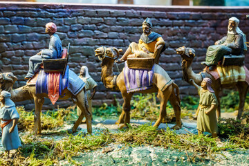Clay figures representing the three kings of the east in a traditional nativity scene