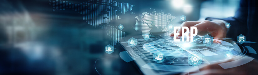 A man using a laptop analyzes workflows for enterprise resource planning. Examines financial data...