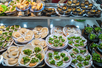 Deliciously Garnished Oysters Beautifully Displayed on Plates for Your Enjoyment