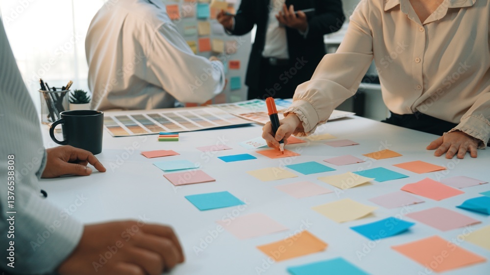 Poster a dynamic scene of a team engaging in a brainstorming session using colorful sticky notes. the atmos