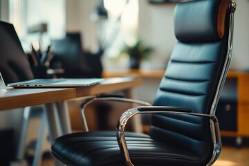 Close-Up of an Office Chair with a Laptop on a Desk in a Bright, Modern Office Space