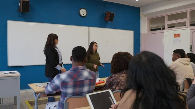 Engaged students listening to presentation in classroom setting