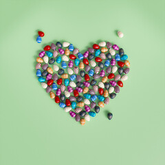 Heart-Shaped Easter Egg Arrangement on Pastel Background