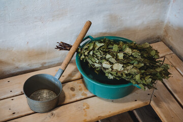 A bright green bucket, brimming with sparkling water and vibrant leaves, is placed gracefully on a...