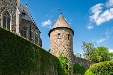 The historic St. Martinus Church in Olpe, Germany, built in neo-Gothic style, features a striking 61-meter tower and intricate architectural details, standing as a cultural landmark.
