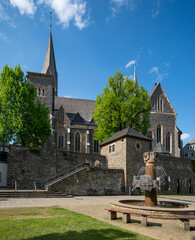 The historic St. Martinus Church in Olpe, Germany, built in neo-Gothic style, features a striking 61-meter tower and intricate architectural details, standing as a cultural landmark.