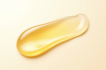 A drop of oil on a beige background