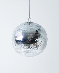 Fototapeta premium Shiny Disco Orb on Crisp White Canvas. Perfect for Dance Floor Vibes and Night Out Excitement