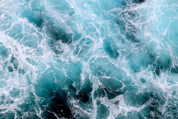 Fototapeta premium The image is of a body of water with a blue and white pattern