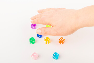 Colorful assortment of plastic dice held in an open hand during a tabletop game session