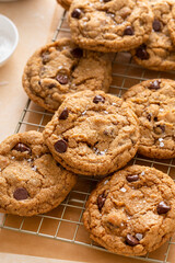 Chocolate chip cookies with pecan nuts, freshly baked cookies on a cooling rack