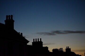 Fototapeta premium silhouette of homes during the sunset