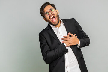 Stressed scared Indian businessman suffers from tension holding chest with heart pain attack risk...