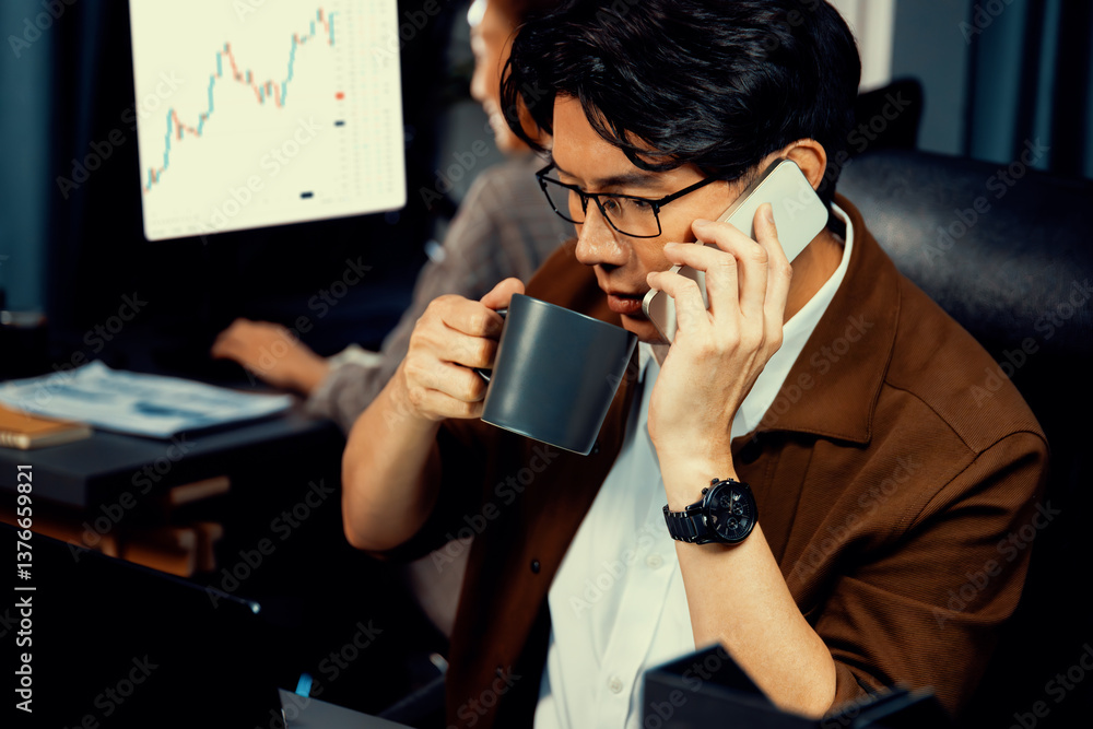 Aufkleber businessman looking on laptop while calling to broker with calculating margin profit while drinking 