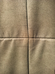 a crumpled surface of fabric divided into four rectangles