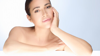 Gorgeous natural woman with flawless glowing skin in beauty and skincare concept, elegant model showcasing healthy fresh complexion