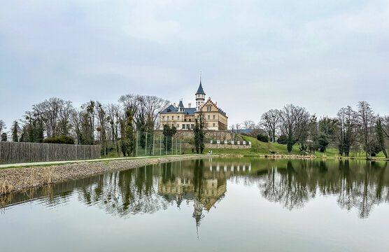 Renaissance old castle Radun near Opava city mirrored in a lake with reflections in water, Czech Republic