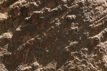 Close-Up Texture of Rough Natural Rock Surface with Intricate Patterns