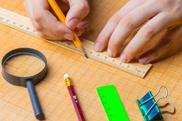 draftsman draws on a ruler