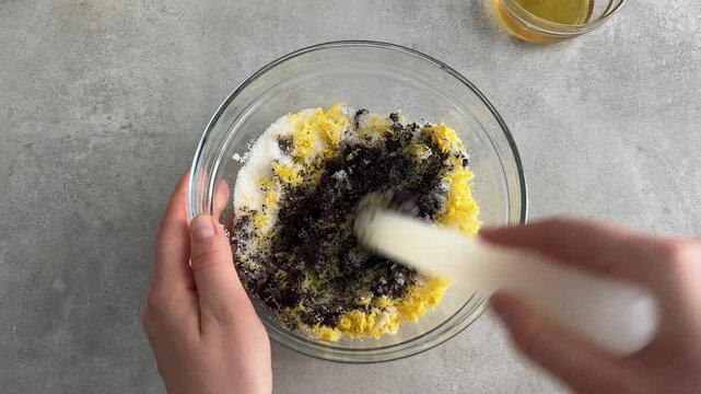 Mixing poppy seeds, sugar and lemon zest for traditional sweet filling
