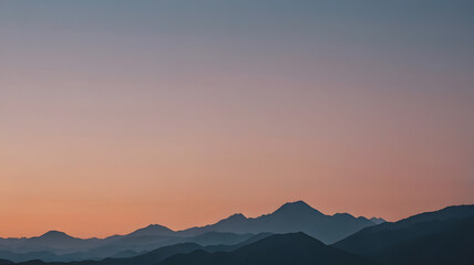 A minimalist mountain range silhouette against a gradient-colored dusk sky