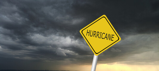 danger,caution,Hurricane Idalia warning sign against a powerful stormy background with copy space. Dirty and angled sign with cyclonic winds add to the drama.hurricane season sign on cloudy background