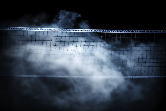 Dramatic volleyball net in foggy atmosphere against dark background