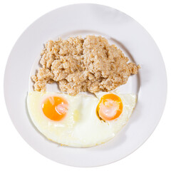 Breakfast with scrambled eggs and oatmeal with butter. Isolated over white background