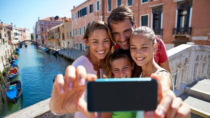 Happy Family Taking a Selfie on a Venetian Bridge