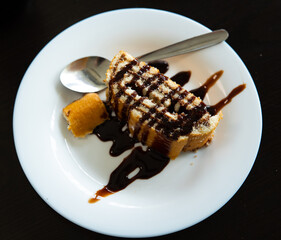 Spanish dessert Brazo de Gitano with filling of nutella