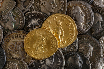 A treasure of Roman gold and silver coins.Trajan Decius. AD 249-251. AV Aureus.Ancient coin of the...