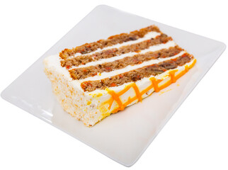 There is tea treat on plate. Piece of carrot cake made with addition of aromatic spices cinnamon...