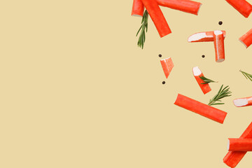 Tasty crab sticks with rosemary and peppercorns flying on green background © Pixel-Shot