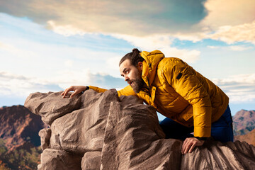 Hiker underestimates the mountain peak and getting exhausted at the top, slipping on rocks causing...