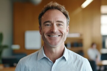 Fototapeta premium Professional male smiling in modern office environment.