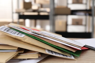Many different envelopes on table in post office. Space for text