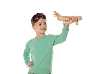 Happy little boy playing with toy plane on white background