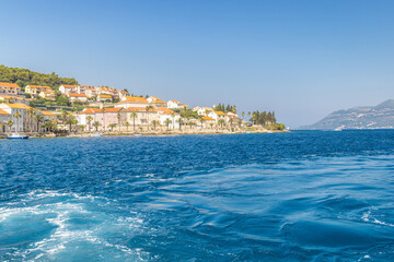 Korcula island in Croatia, Europe. Coastal townscape: azure sea meets quaint architecture against a...