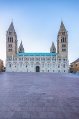 Obraz premium Cathedral in Pecs town in Hungary, Europe. Majestic cathedral with twin towers against a serene sky. A large open square provides a sense of grandeur and spaciousness.