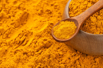 Turmeric is a very healthy species in the spoon and bowl - Curcuma longa
