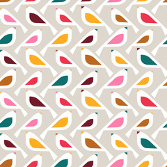 seamless pattern features a repeating design of stylized birds in a variety of colors against a light gray background.
