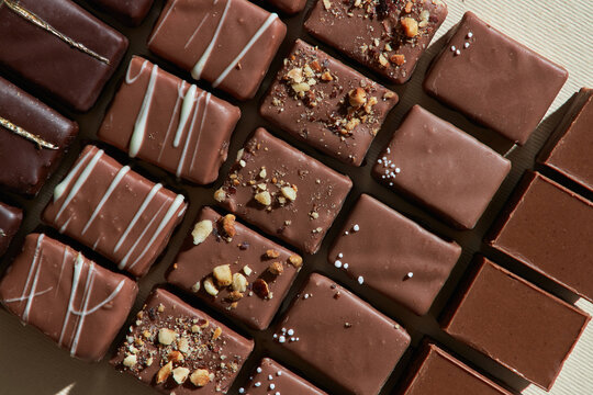 Chocolate pralines in a row.