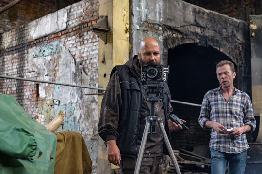 cameraman and assistant working on horror filming