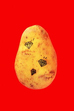 Naklejki Golden potato with diamond tattoos, glowing bright