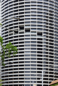 Curved High-Rise Facade with Dark Glass Windows in Australia