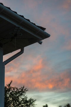 House Roof Edge Silhouette At Sunset 
