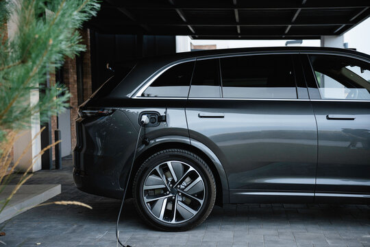 The cable is connected to the electric car