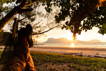 Relaxing in a Hammock at Sunset Beach. Malaysia